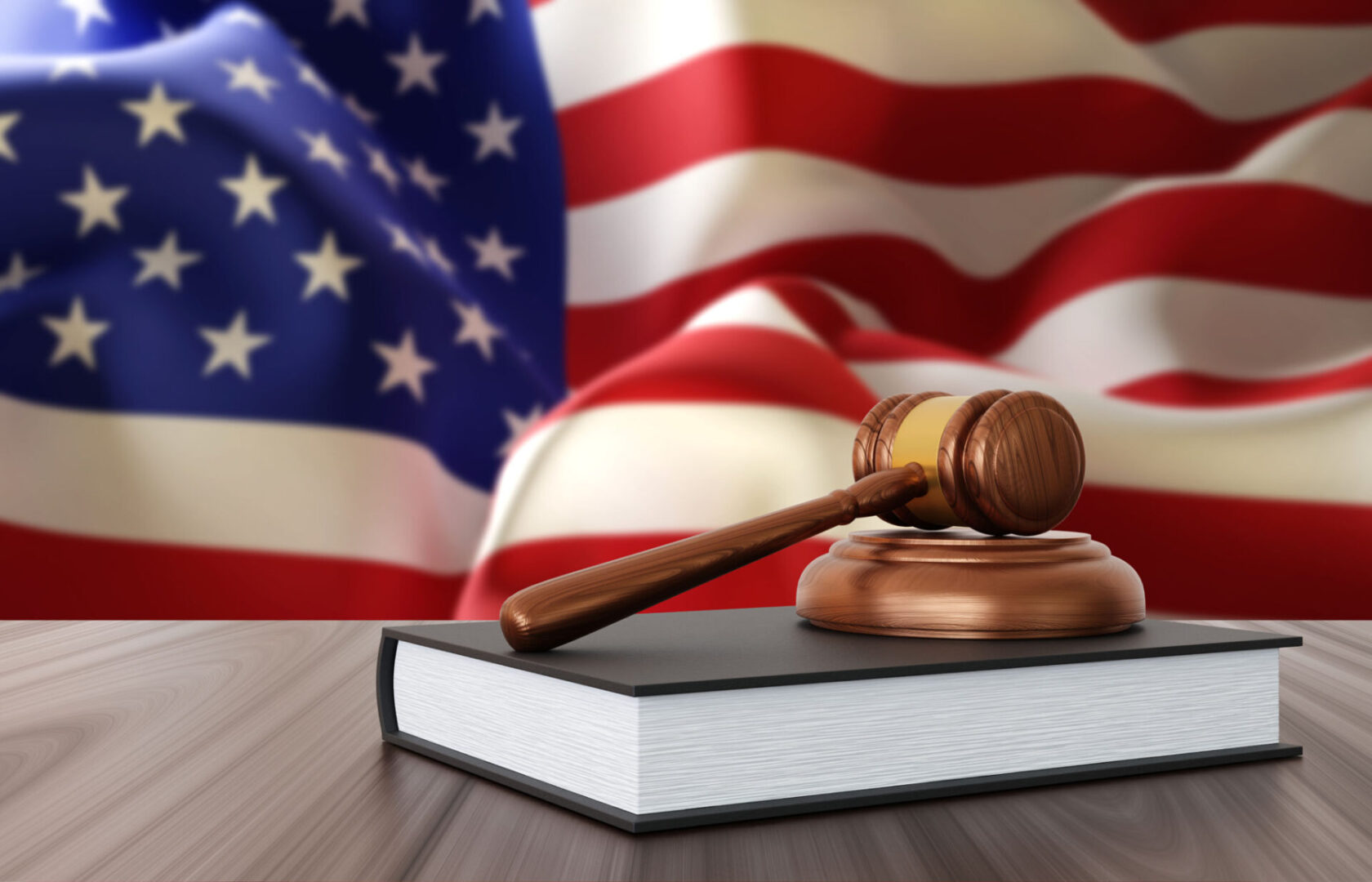 Law book and gavel, flag backdrop