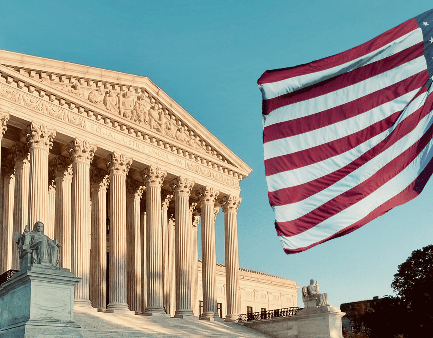 US Supreme Court building with flag